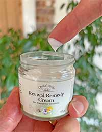 Person using Revival Remedy Cream